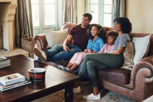 Family sitting together on couch